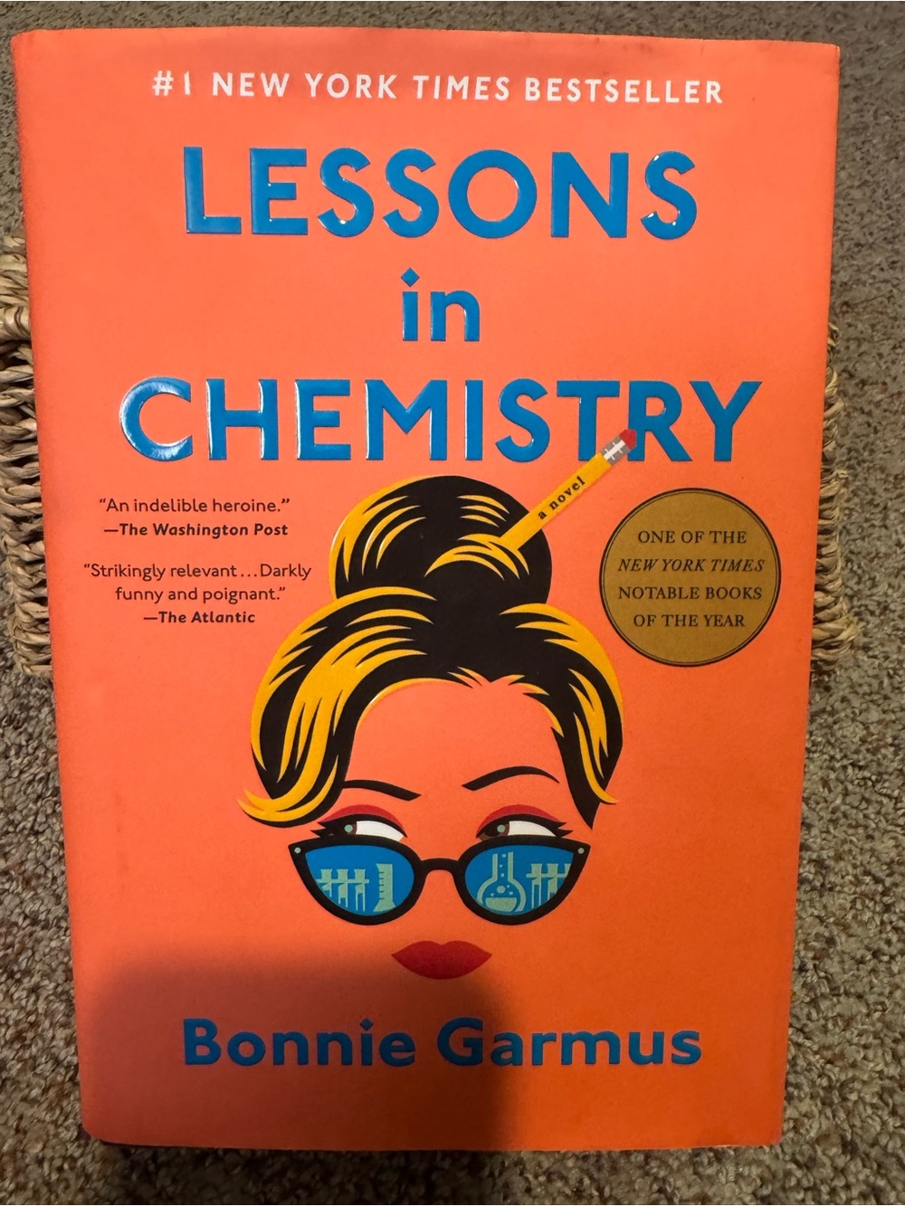 Lessons in Chemistry by Bonnie Garmus - Bright Orange Hardcover
